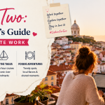 Digital nomad couple working remotely from a rooftop café in Lisbon during sunset with panoramic city views, laptops, and romantic travel atmosphere.